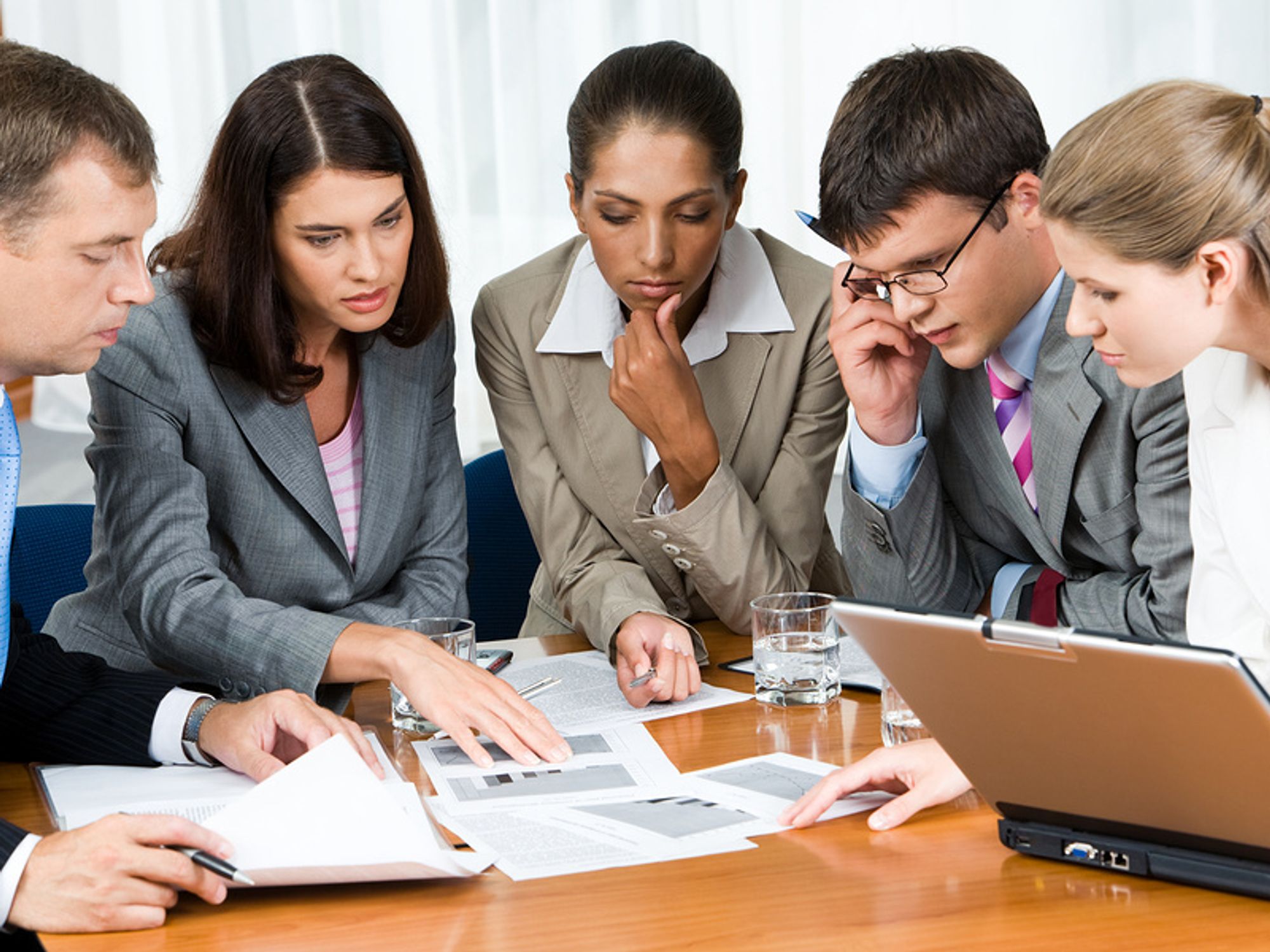 Concerned co-workers gather to discuss mistakes being made in the company's employer branding strategies.