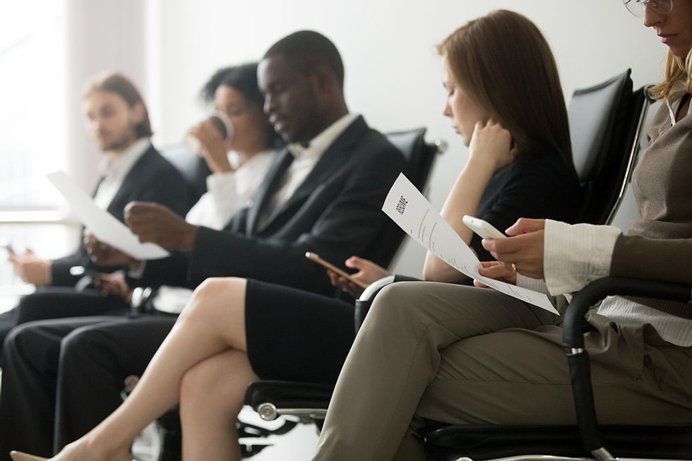 Confident job candidates wait to be interviewed