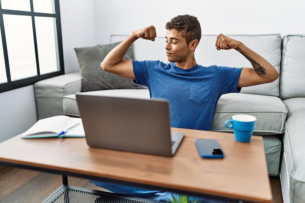 Confident man on laptop prepares for his next job interview