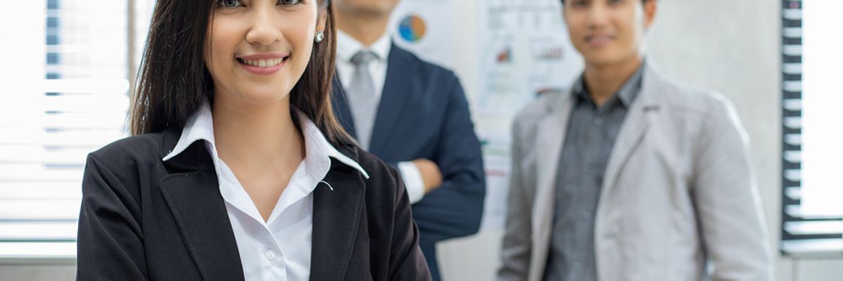 Confident professional woman achieving career success at work