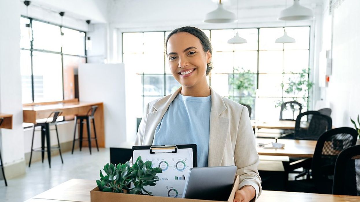 Confident young woman smiles on her first day of her new job.