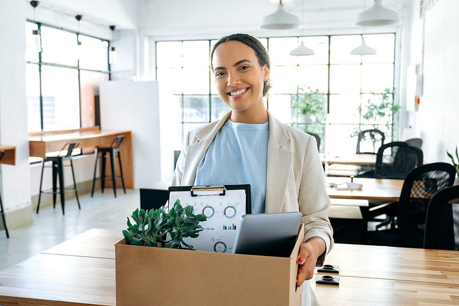 Confident young woman smiles on her first day of her new job.