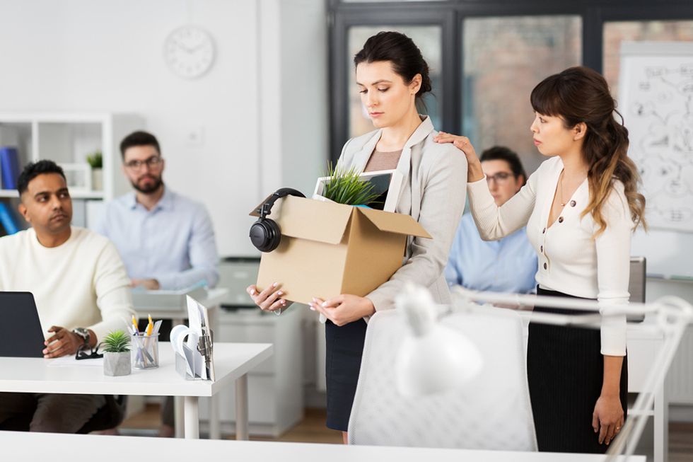 Coworker consoles woman who just got laid off