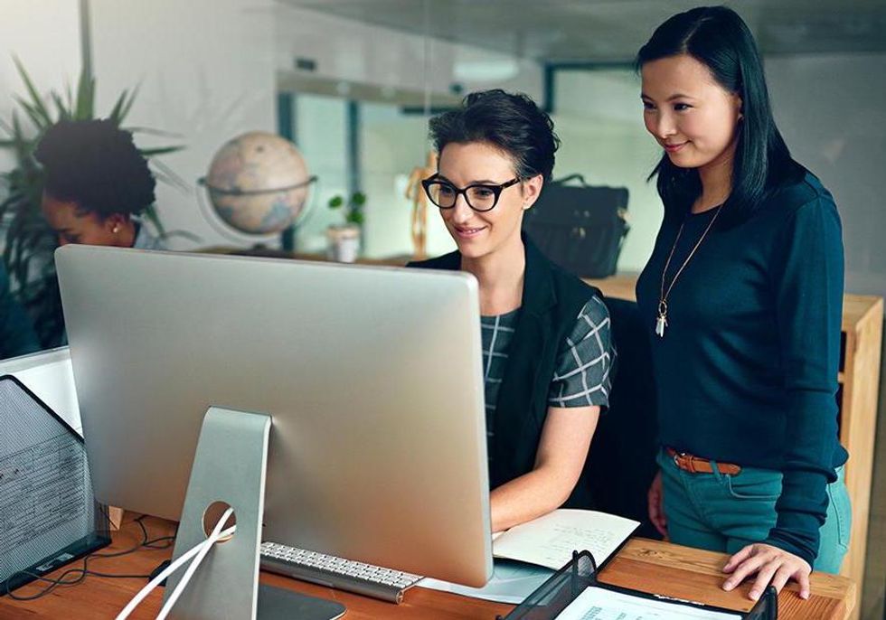 Coworkers at Intel collaborate on a project.
