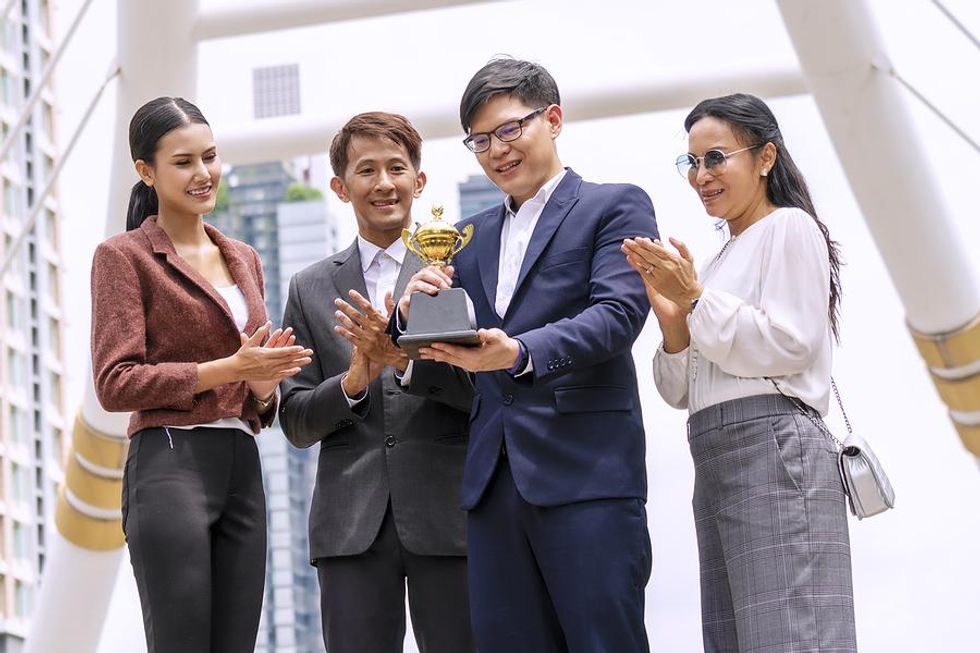 Coworkers celebrate a company award.