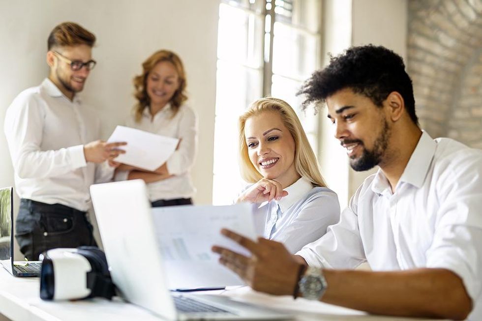 Coworkers talk during a work training session