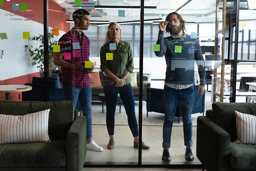 Coworkers work on challenging tasks together