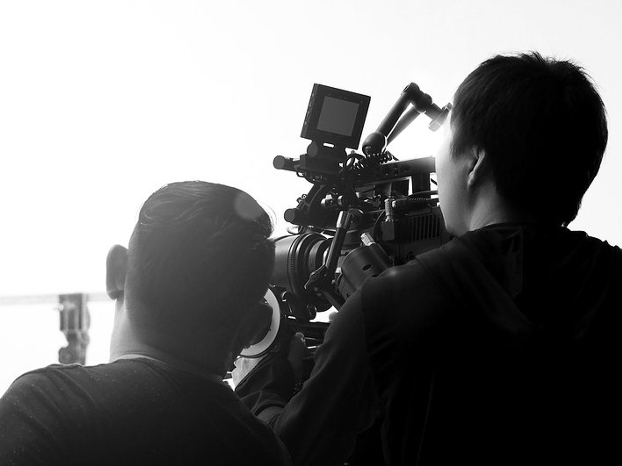Creative professionals/filmmakers collaborate on a project