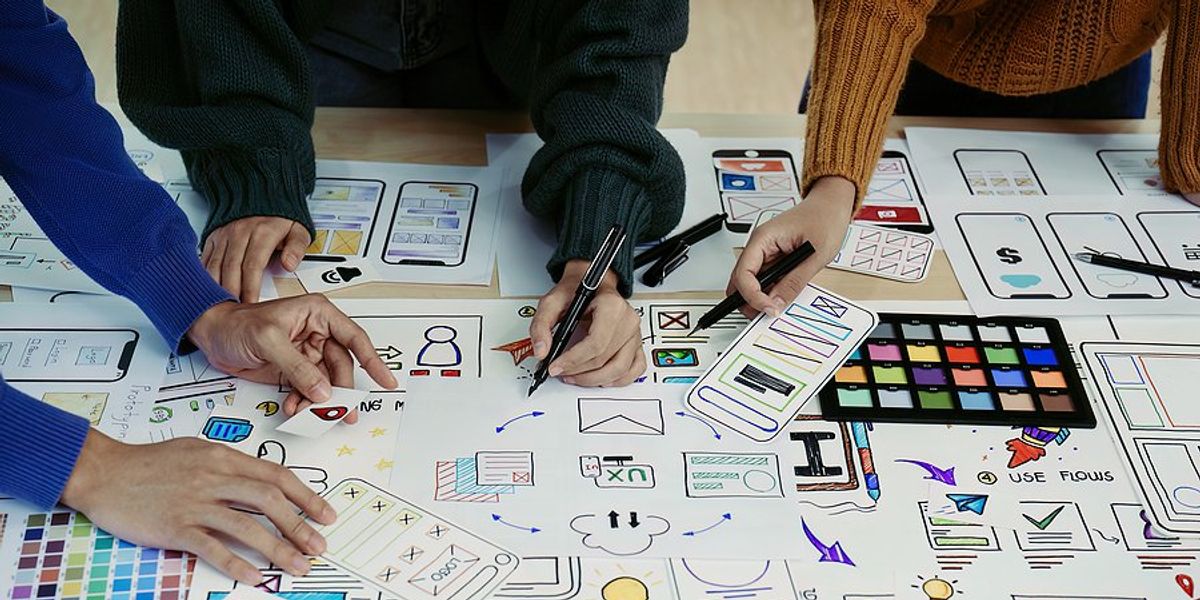 Creative professionals use a strategy for project success during a meeting