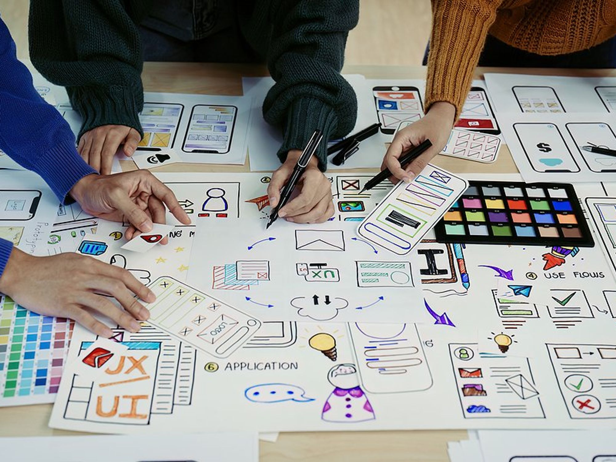 Creative professionals use a strategy for project success during a meeting