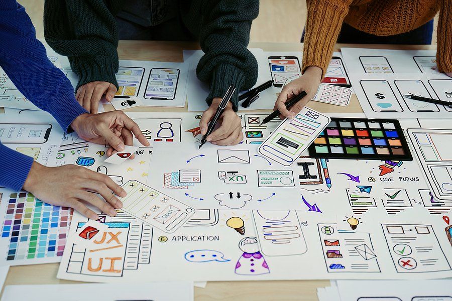 Creative professionals use a strategy for project success during a meeting