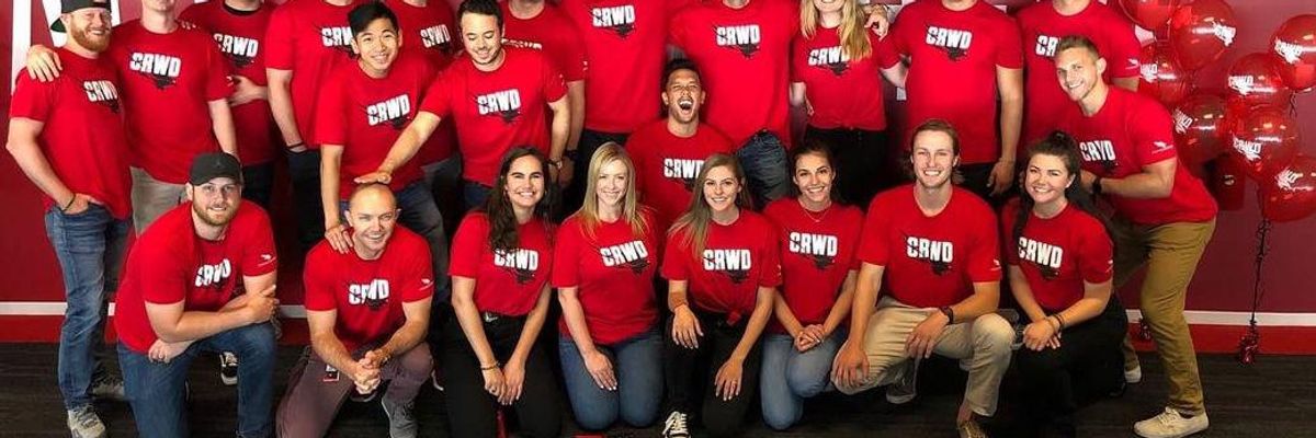 CrowdStrike employees pose for a photo.