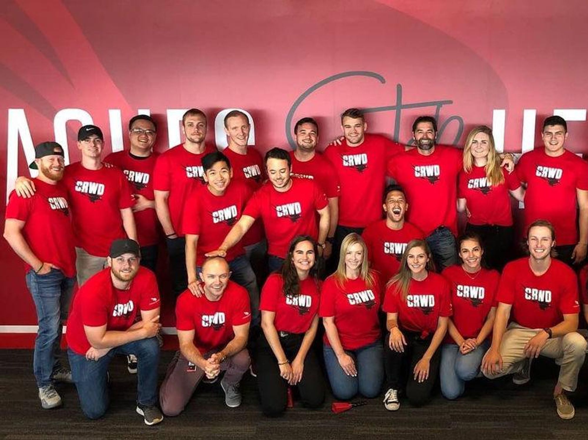 CrowdStrike employees pose for a photo.