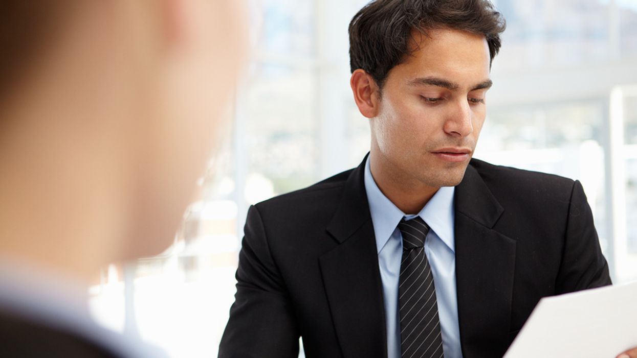 Disappointed businessman reflects after being rejected for a job during an interview