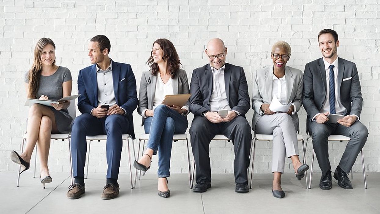 Diverse job candidates wait for an interview