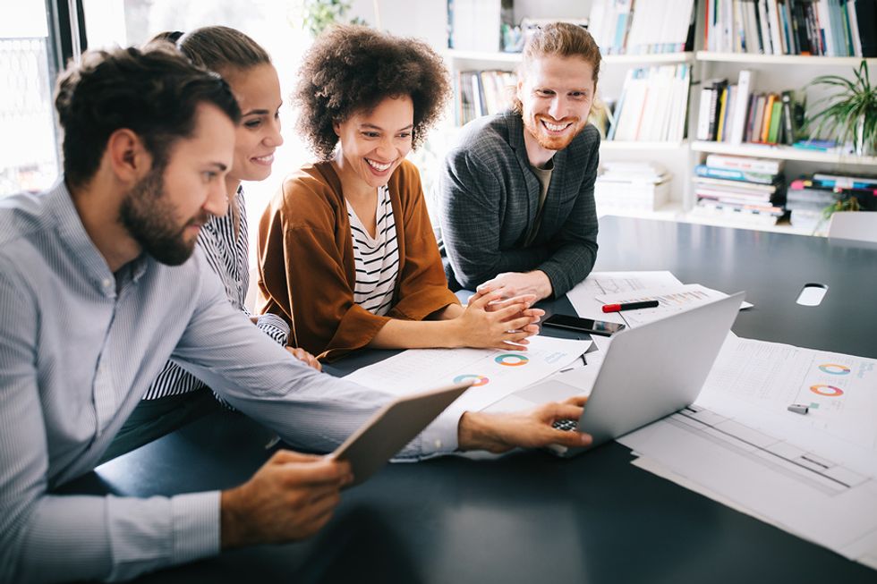 Diverse team attends a meeting in their inclusive workplace