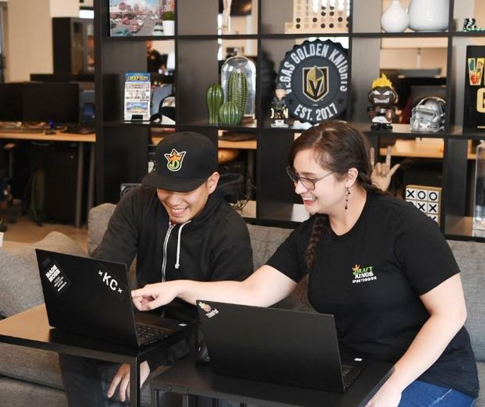 DraftKings employees collaborate at the company's Las Vegas office.