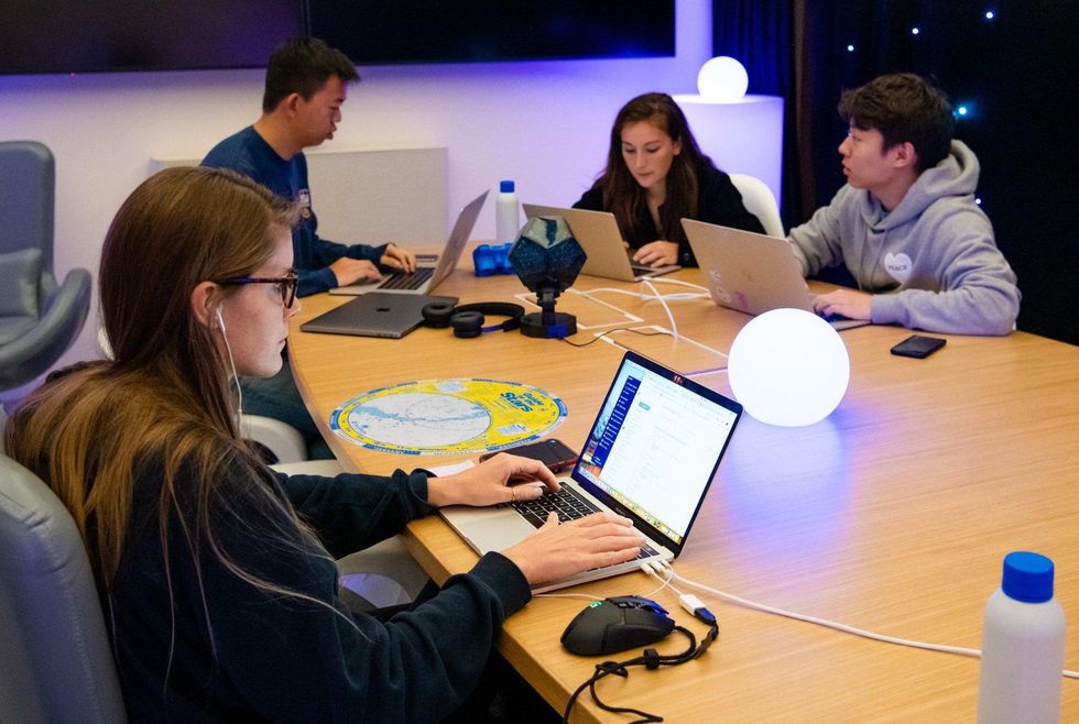Dropbox employees collaborate together on a project.