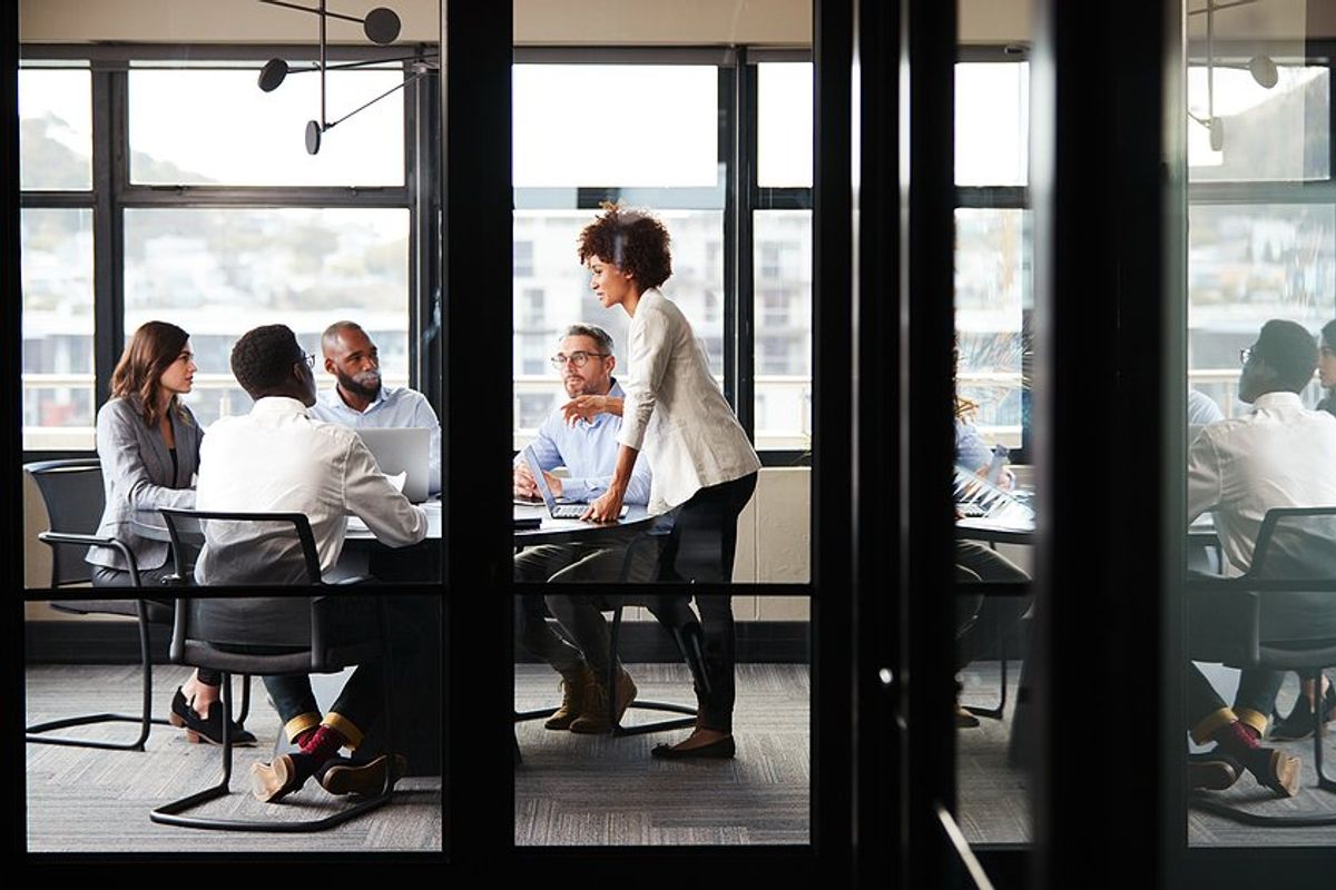 Employees focused during a meeting at work to talk about breakthrough results