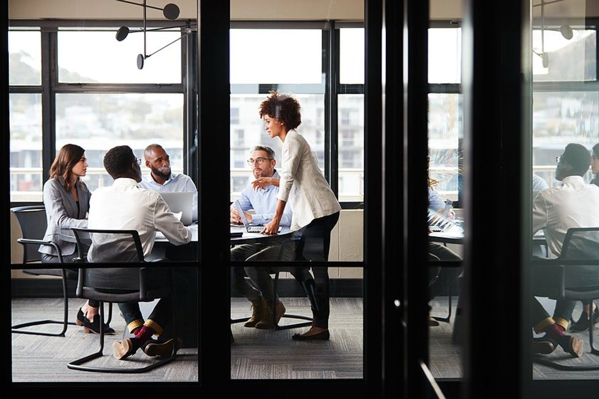 Employees focused during a meeting at work to talk about breakthrough results