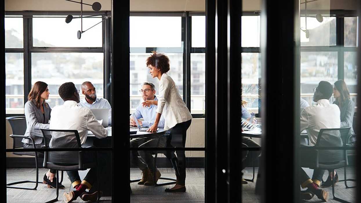 Employees focused during a meeting at work to talk about breakthrough results