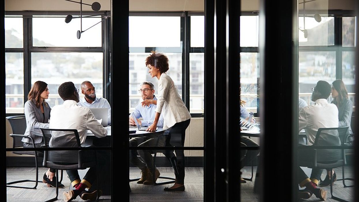 Employees focused during a meeting at work to talk about breakthrough results