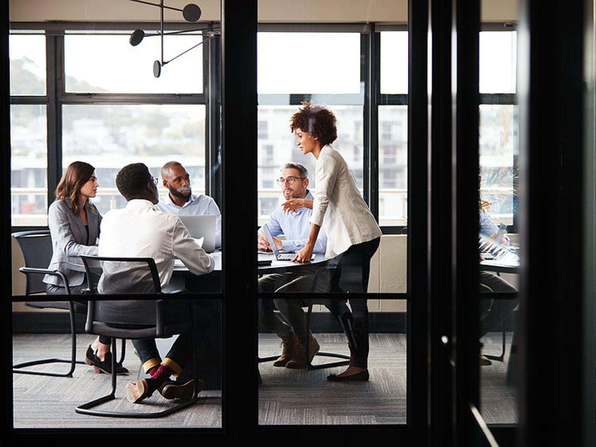Employees focused during a meeting at work to talk about breakthrough results