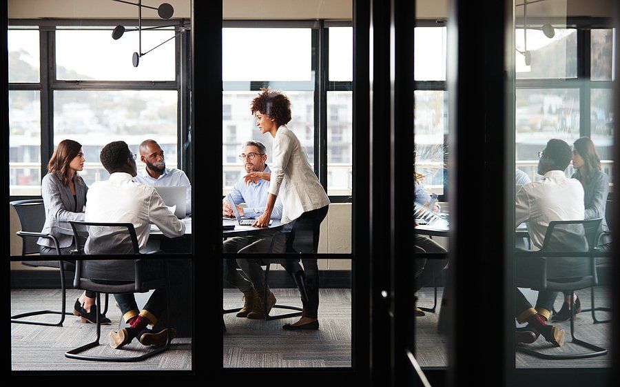 Employees focused during a meeting at work to talk about breakthrough results