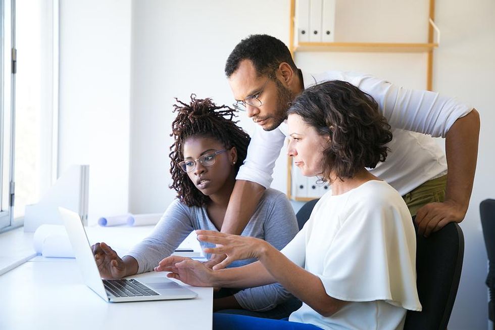 Employees help an incompetent boss