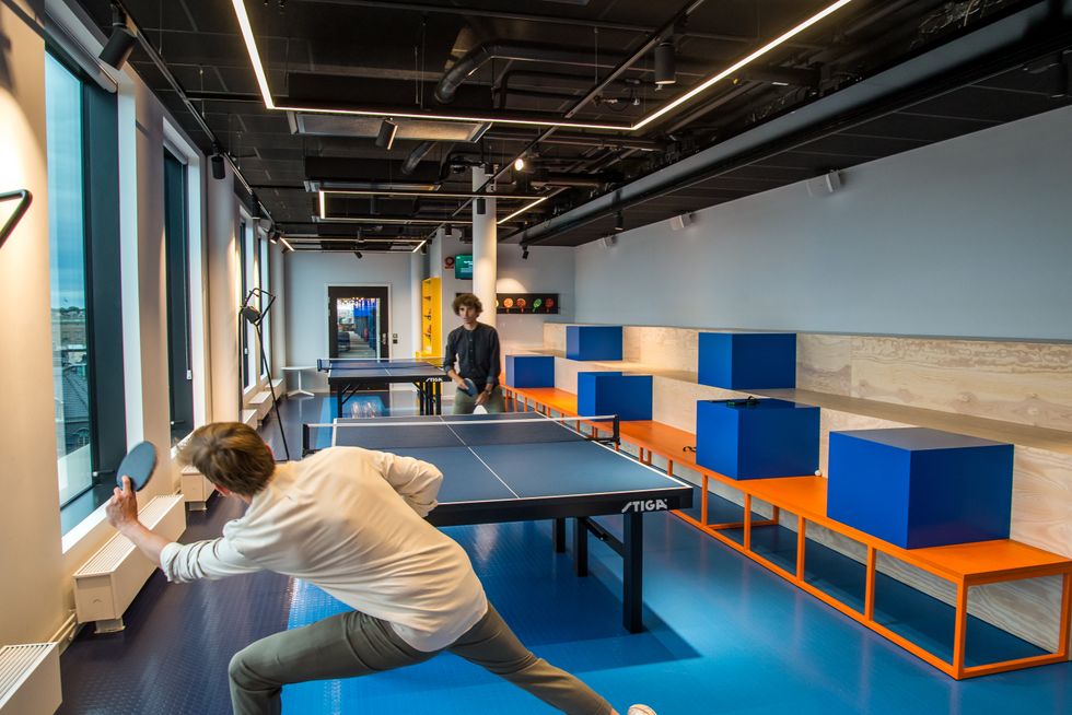 Employees play ping pong at Spotify's Stockholm, Sweden headquarters.