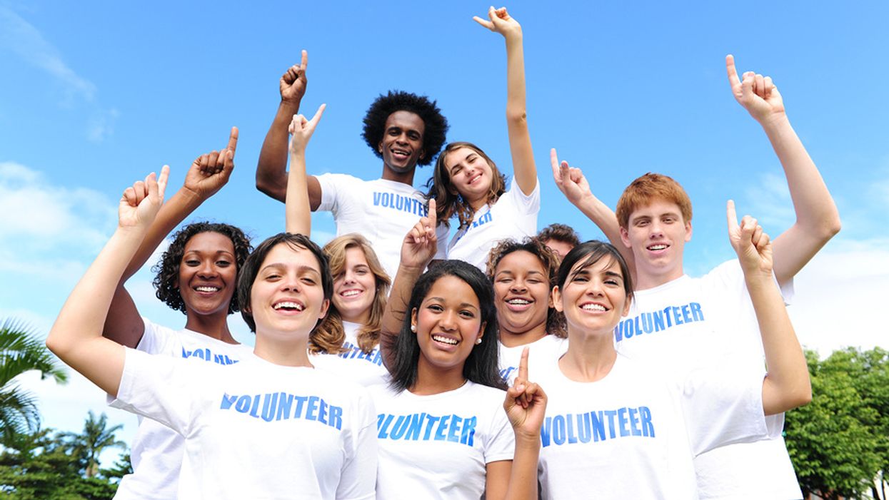 Employees pose for a photo after taking part in a workplace community service project