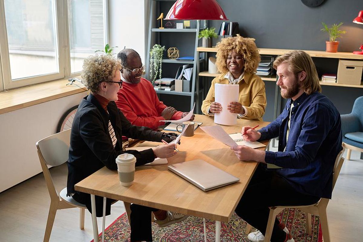 Employees talk during a work meeting