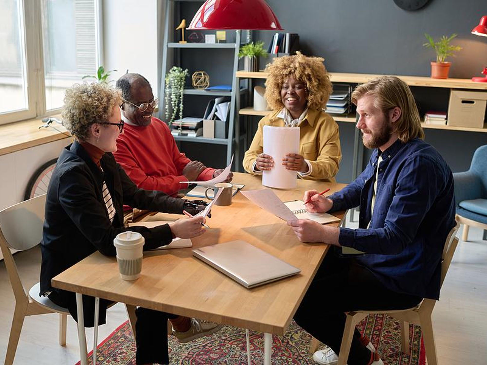 Employees talk during a work meeting