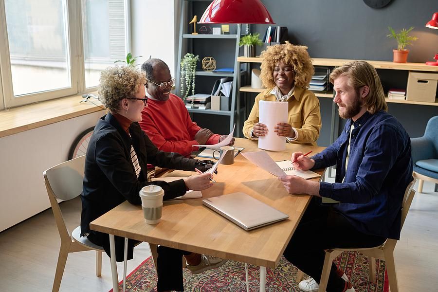 Employees talk during a work meeting