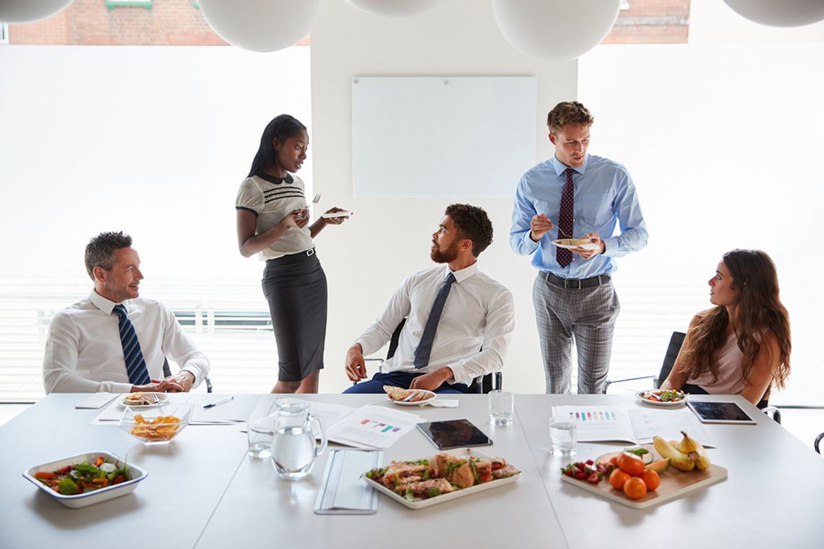 Employees with food allergies in the office eat lunch