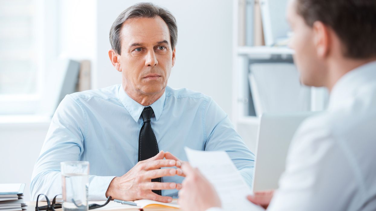 Employer asking a job candidate interview questions to find out more about him