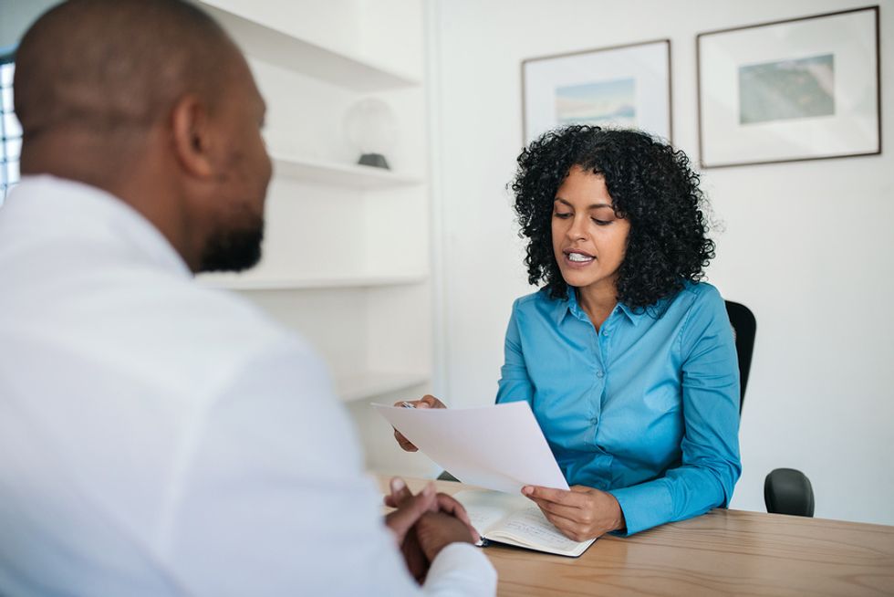 Employer reviews an executive resume with quantifiable accomplishments
