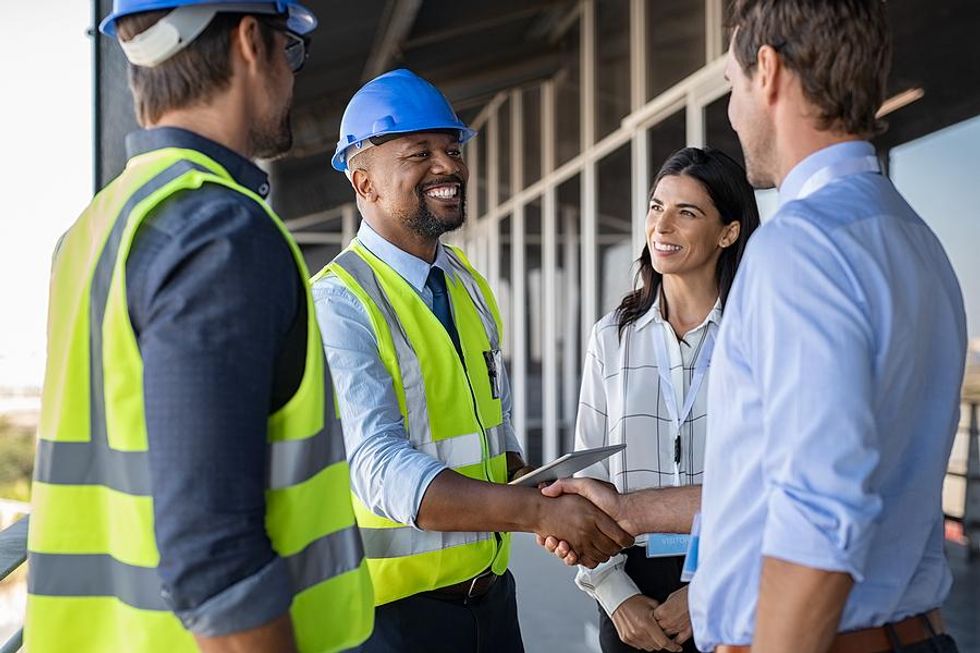 Engineer shakes hands with a customer