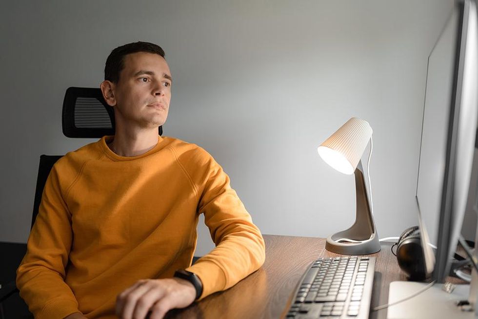 Engineer waits at his computer