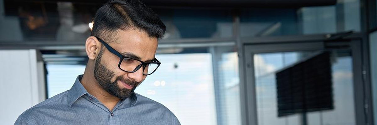 Executive/business leader uses a new technology at work