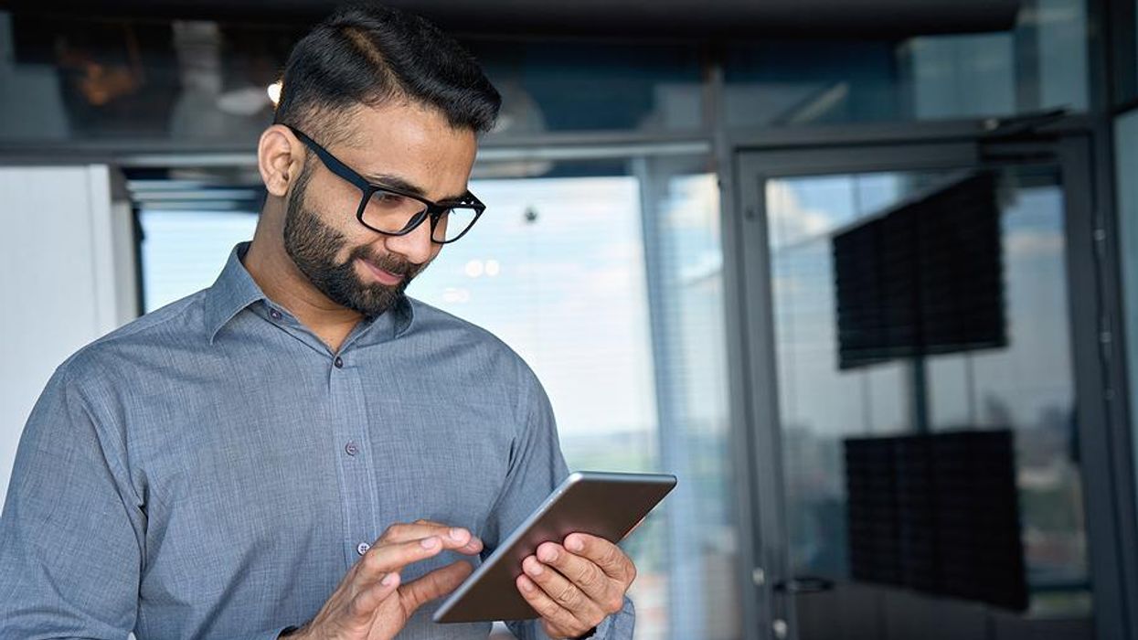 Executive/business leader uses a new technology at work