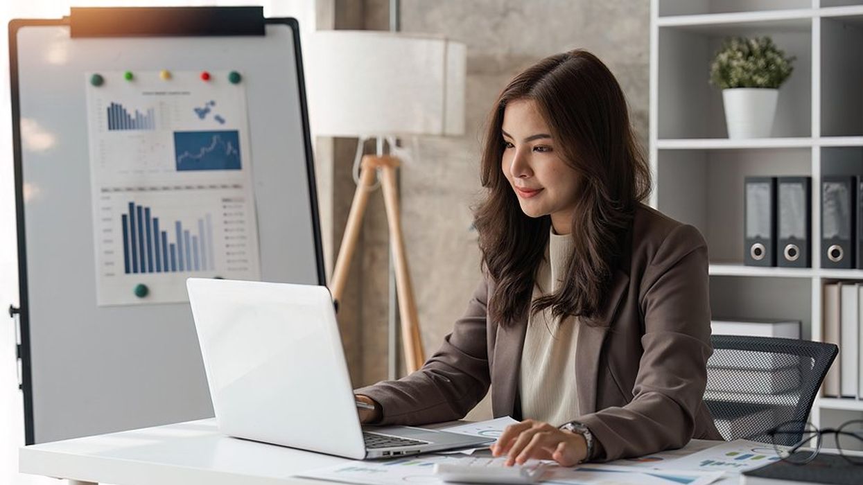 Executive/businesswoman sets up a budget at work