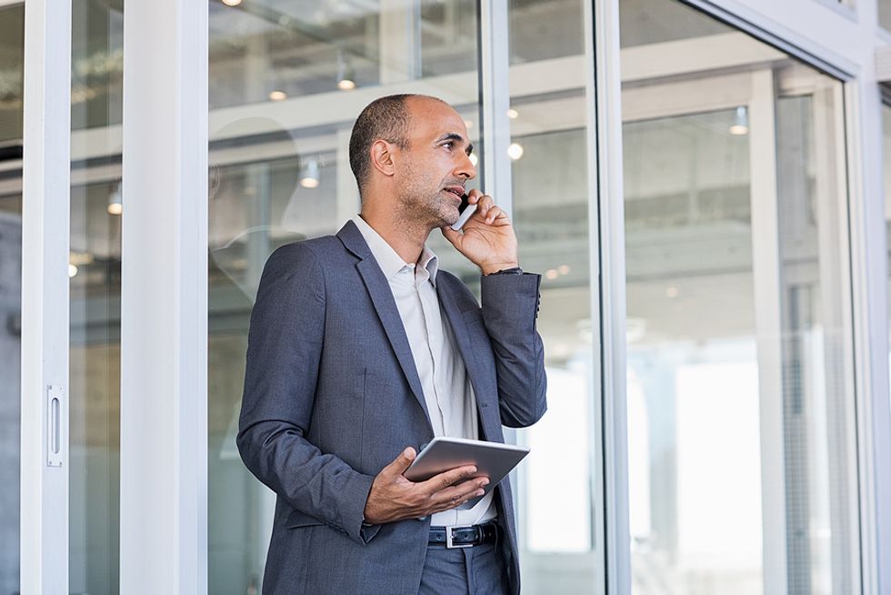 Executive communicates at work