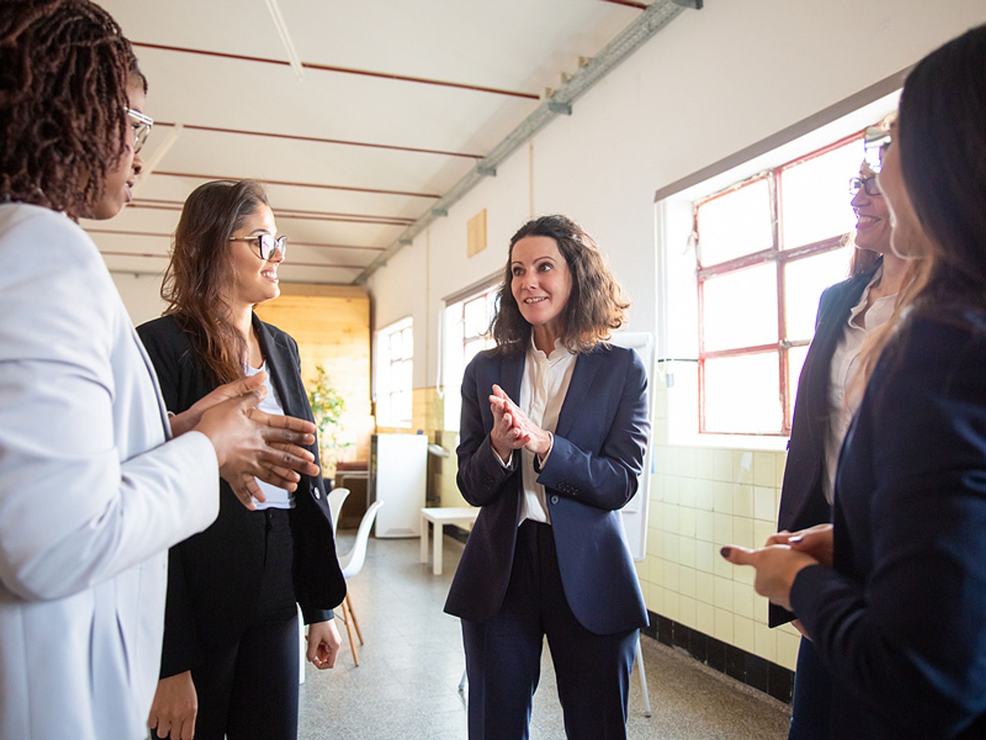 Executive effectively communicates with her colleagues