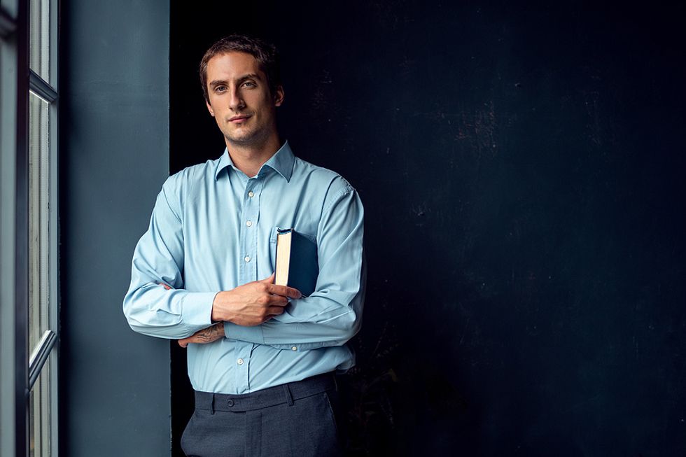 Executive holds a book that he's reading
