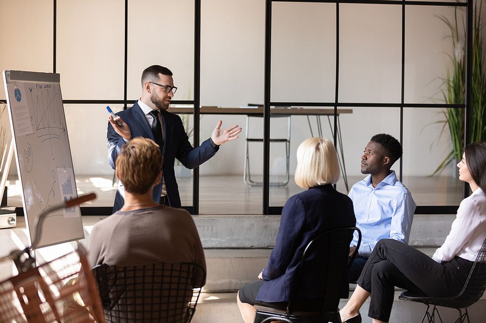 Executive looks at his colleagues during a presentation