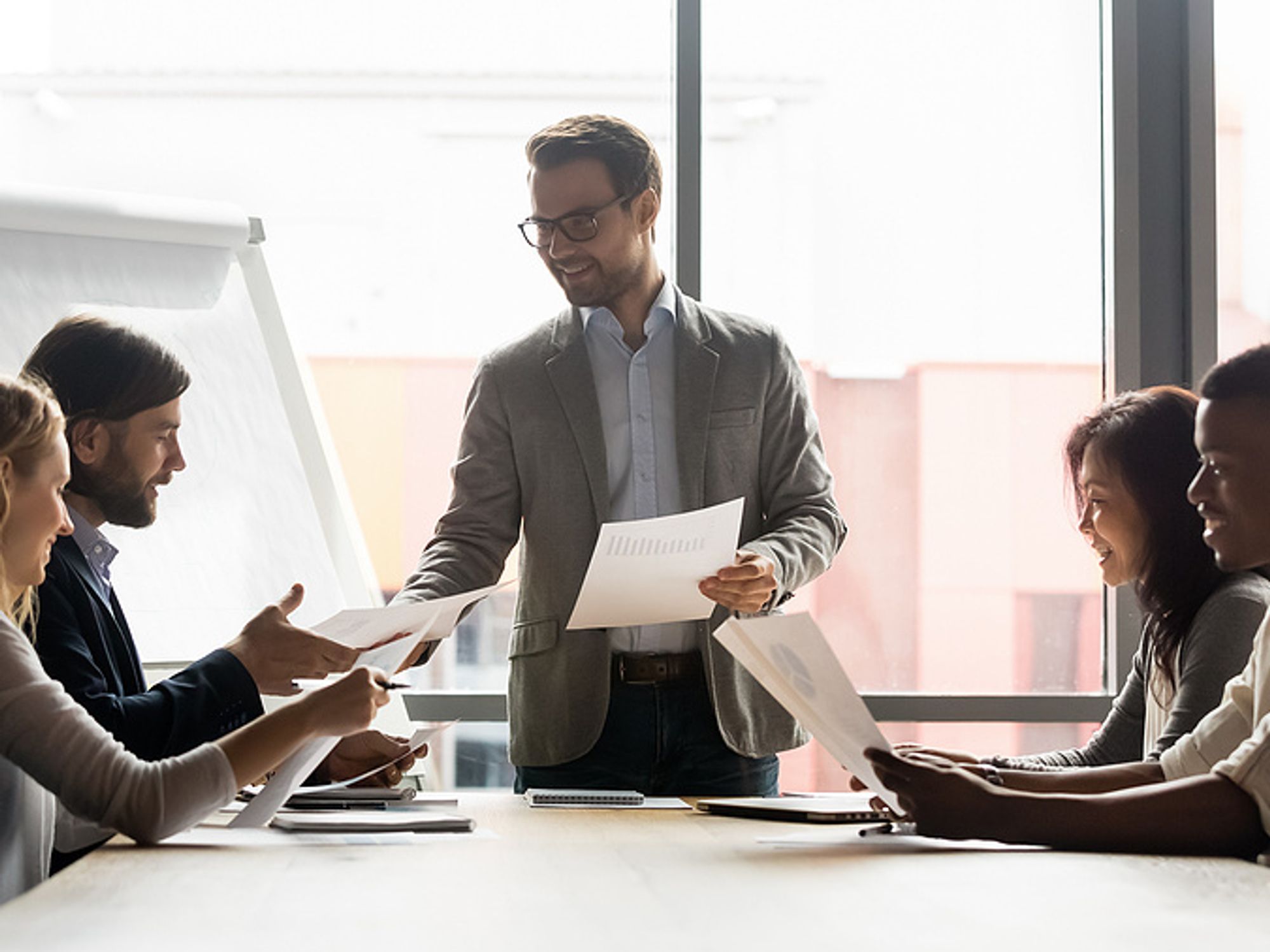 Executive meets with his colleagues during COVID-19