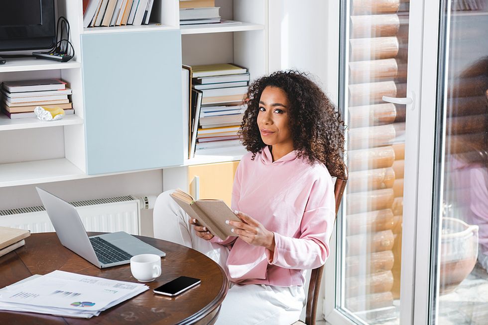 Executive reads a book during her work break