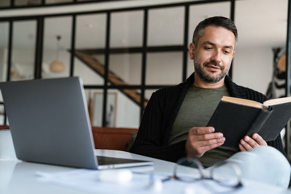 Executive reads a book during his work break