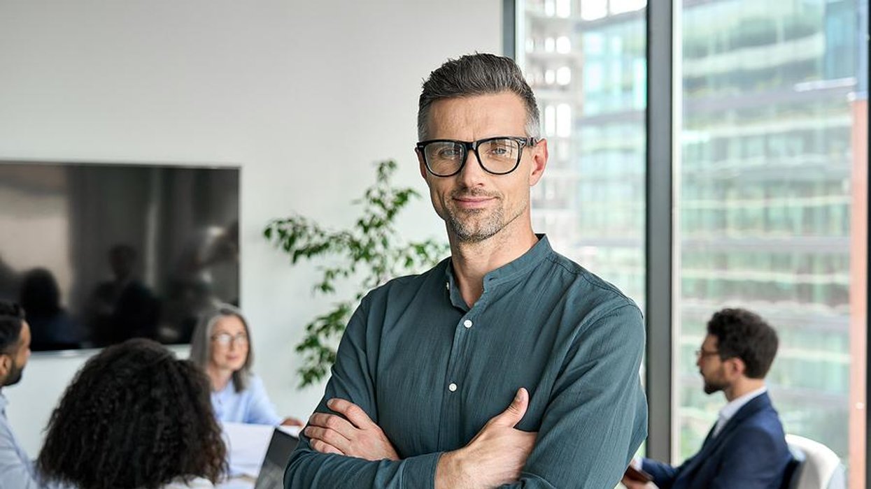 Executive smiles at the camera